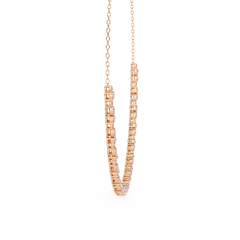 Rose gold hoop earrings on a white background